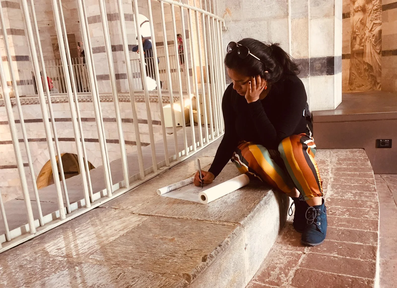 student drawing on a pad in florence